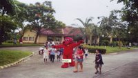 Clifford led the children as they went on parade within the Village that signaled the start of the Book Fair. <br />