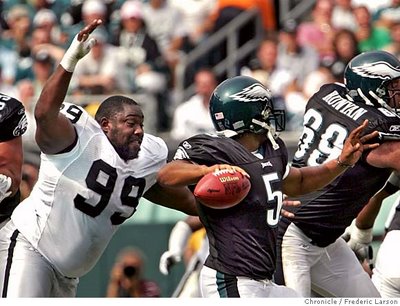 Warren Sapp tries to eat Donovan Mcnabb