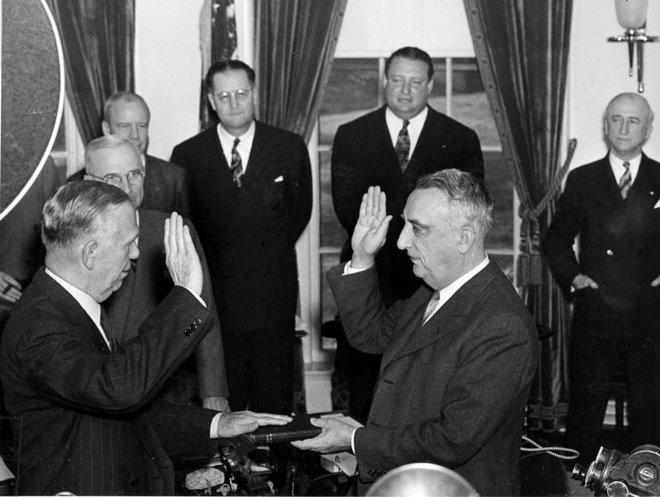 Harry Truman watches George C. Marshall take oath as Secretary of State