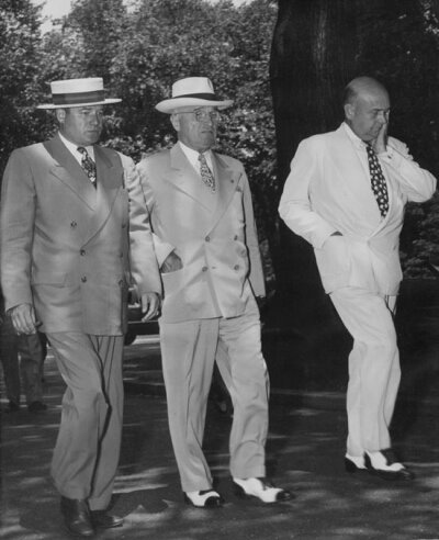 President Truman walks with aids soon after news of Chinese entry into Korean conflict