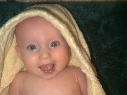 Mary in a towel at 5 months
