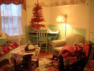 Cate's tea room with new pink tinsel tree - see the pile of fabric in the chair on the right? She was showing me her stash