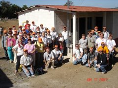 The 2007 Guatemala - Project 100 team, a painted home, and a completed stove