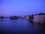Moon over Vltava River in Prague