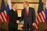 President George W. Bush and President Vladimir Putin of Russia exchange handshakes Sunday, Nov. 19, 2006, at the Sheraton Hanoi after their two countries signed agreements supporting Russia's accession into the World Trade Organization. Said President Bush afterward, 'This is a good agreement for the United States. And it's an equally important agreement for Russia. And it's a good agreement for the international trading community.' White House photo by Eric Draper.
