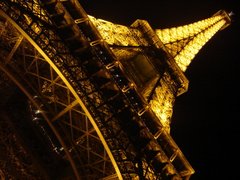 A view from the base of the Eiffel Tower at night in Paris