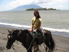Riding Horses on the Beach in the Presence of an Active Volcano