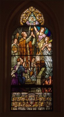 Saint George Catholic Church, in Hermann, Missouri - stained glass window: praying for the living and the dead