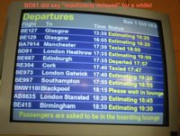 Belfast City Airport departure screen showing delayed flights
