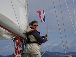 Raising the courtesy flag approaching Martinique (between squalls)