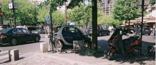 Smart car parked at vertex of a junction