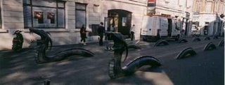 Bronze serpents separating pedestrians and traffic