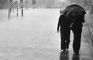 Sharing the umbrella - Sharing the rain - Walmink @ Flickr