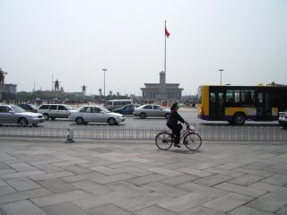 Tiananmen Square with bicyclist. Beware of tea-shop scammers.