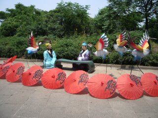Crazy scene featuring cranes and dummies, Golden Crane Pavilion, Wuhan