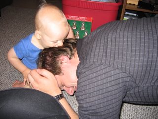 Rick rubbing his head on Matthew as Matthew bites his hair.
