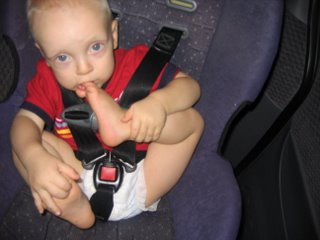 Matthew in the carseat biting his big toe