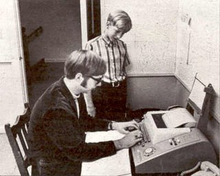 Bill Gates and Paul Allen using Model 33 Teletype