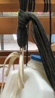 I tied the bout onto the weight with a slip knot and a shoe lace.
