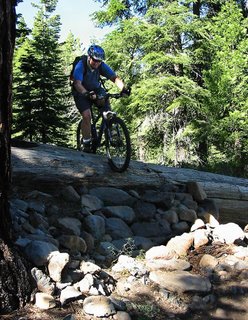 Nancy taking the extreme line over a log obstacle.