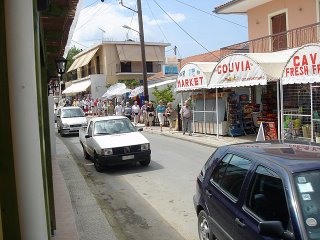 tourists coming down Gouvia main street