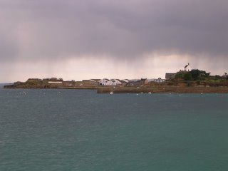 Roscoff, house over hill in a cloudy weather