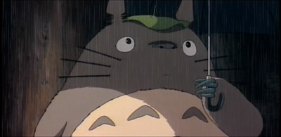 Totoro holds an umbrella