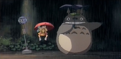 Totoro lands, Mei and Satsuki are bounced up
