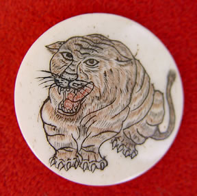 scrimshaw on bone, tiger button, Japanese