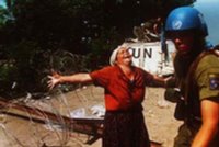 Bosnian Muslim woman asks U.N. soldier for help to prevent Srebrenica massacre. U.N. stood helpless while over 8,000 men and boys (children) were massacred by Serb forces on July 11th 1995.