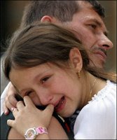 Srebrenica Massacre (7/11 1995) - Srebrenica girl remembers her murdered family years later and cries; wounds are still fresh.