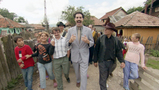 Cousin Borat near his home in Kazakhstan with neighbors