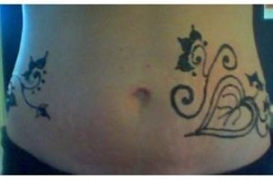 henna tattoo on the front of the belly