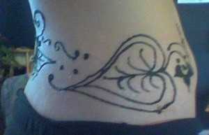 side view henna waist tattoo