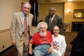 Image of Four People at AAPD 16th Anniversary of Americans with Disabilities Act