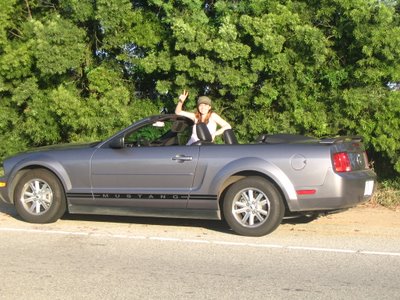 Victoria in the convertible Ford Mustang