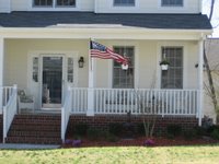 US Flag hanging outside a home