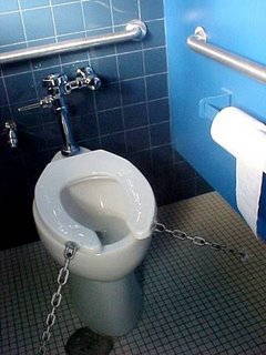 Toilet with its seat chained to the floor