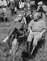 Ursula and Marcello relax on the set