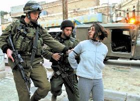Israeli Occupation soldiers kidnap girl in Hebron.