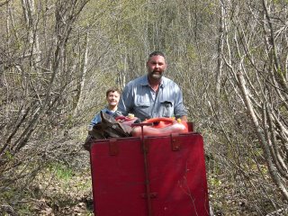Dave and Ray with the power carrier, a motorized cart on tracks