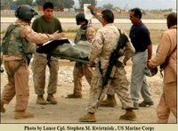 Corpsmen Treat Girls Injured by Land Mine
