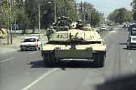 US Soldiers on patrol in a tank on Baghdad streets.