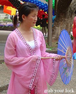Chinese New Year parade Sydney 2006 female with parasol