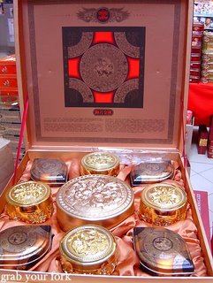 mooncakes silver and gold tins