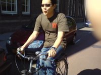 Alex cycling through the streets of Rotterdam