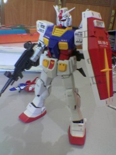 Gundam with beam rifle, shield and bazooka mounted on the rear skirt armor