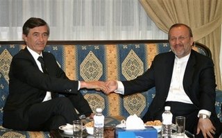 Iranian Foreign Minister Manouchehr Mottaki, right, shakes hands with his French counterpart Philippe Douste-Blazy, left, at the Iranian Embassy, in Beirut, Lebanon, Monday, July 31, 2006