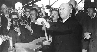 Jean Monnet inspecting the first steel ingot produced under the European Coal and Steel Community regime