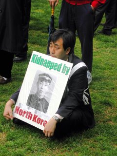 Japanese Man protesting in LaFayette Park